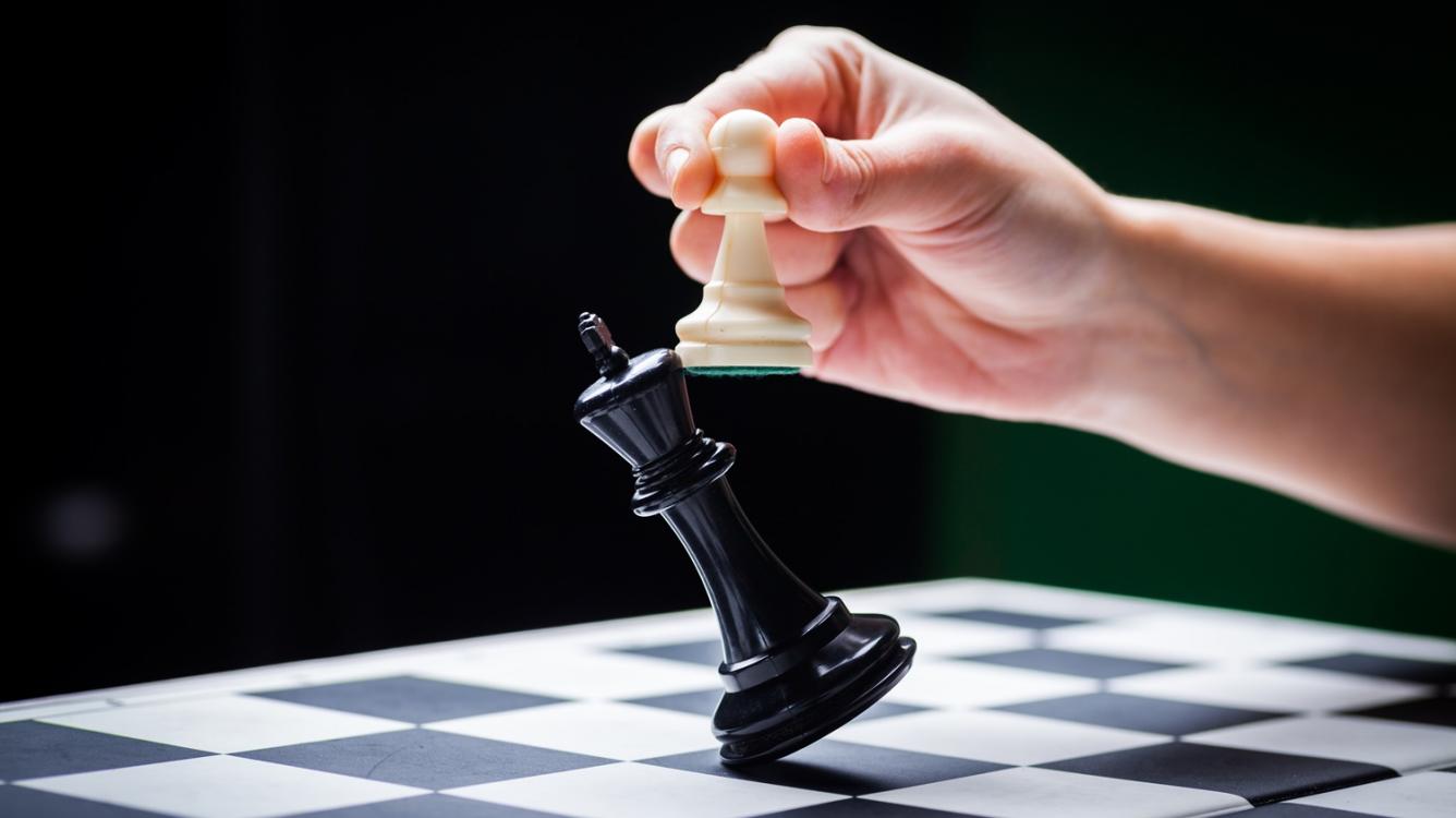 Image of King toppled by pawn.